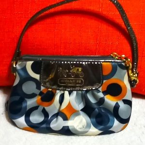 Vintage Coach multi colored satin and patent leather wristlet.